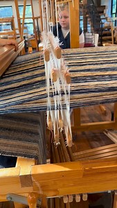 Seeing this chenille blanket from another perspective. With each push of the pedal, four shafts alternate, one and three, then two and four, working together to interlock the threads. As Deborah throws her shuttle across the open shed, pulls her beater forward and changes pedals, the fabric grows. You can see there’s a rhythm to weaving that we find very relaxing. If you’d like to try your hand at weaving or take a class we have a number of options available. Contact us at info@homesteadfibercra