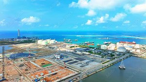 An oil depot from a drone aerial view, The site may also feature loading and unloading areas for trucks and railcars, as well as a pier or jetty for receiving and dispatching oil tankers. 4K HDR Stock ビデオ