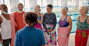 Pool, trainer and senior people, exercise and happy for learning in class of swimming and gym. Training, healthy and fitness for old friends in retirement, cardio and listening for lesson in water