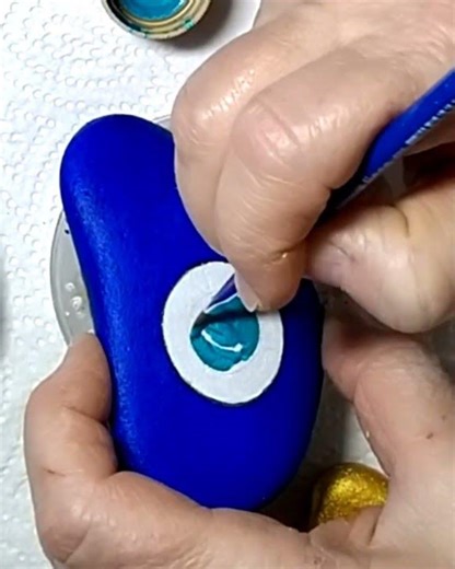 Painting uniquely shaped sea stones