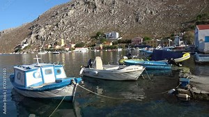 Symi island, Greece - 9th of October 2023: 4K Small bay and boats of Symi island