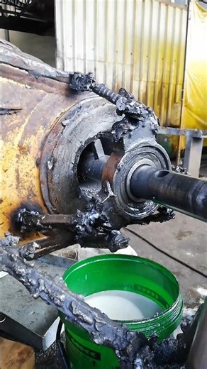 SMOOTHENING THROUGH EXCAVATOR'S DIPPER STICK WORN HOLE AFTER MAG WELD BUILD UP IN WORKSHOP