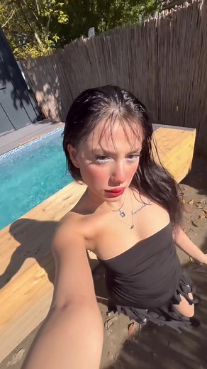 Young Woman Explores Beautiful Backyard and Pool