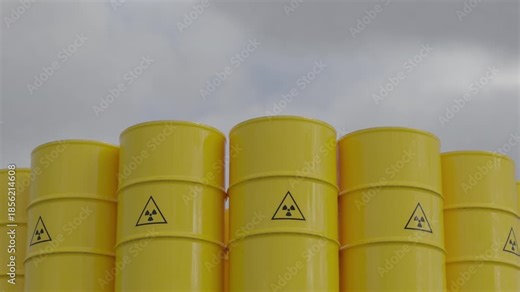 Close view of yellow radioactive waste barrels with hazard symbols. Loop animation for nuclear risk, energy crisis, safety concepts, news visuals and presentations. Part of series.