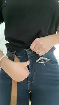 Buttoning and unbuttoning tight blue jeans and unbuckling black belt #3