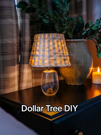 This lamp looks designer, but it started with Dollar Tree pieces 🤯 I turned a candle holder, glass, basket, and lights into a cordless table lamp and it completely changed the vibe of the space. I just shared the full video with this project plus the rest of the high-end Dollar Tree DIYs. Tap the link in my bio to watch the new youtube video with all the tutorials! ✨ #dollartreediy #budgetdecor #CozyHome