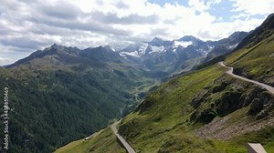 A mountain pass, also known as a high mountain pass, is a route through a mountain range or over a ridge. As such, it is usually higher in elevation than the surrounding terrain. Alps Summer Italy