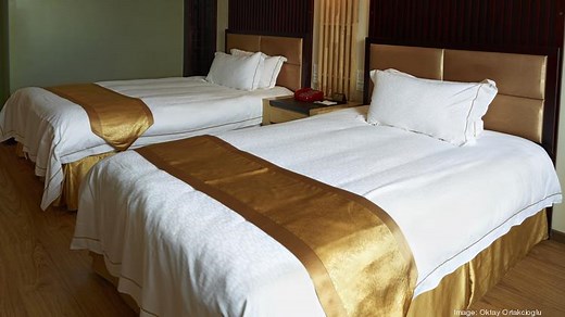 Managing: Should traveling employees be forced to share a room?