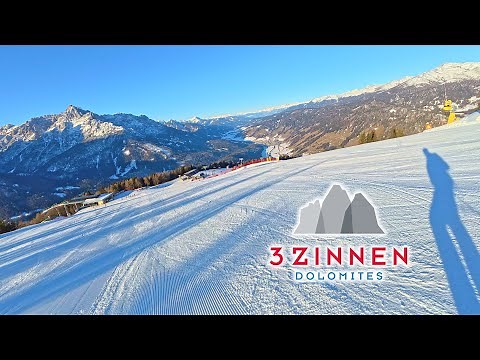 Skiing 3 Zinnen Dolomites - long red piste 16/13 6km long 1075 descent. Fine ski resort north Italy