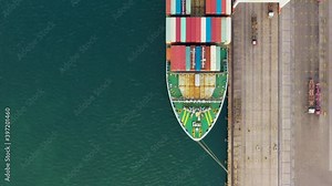 Container ship loading and unloading in deep sea port, Aerial view of business logistic import and export freight transportation by container ship, Container loading cargo freight ship 4k video