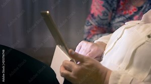 Professional video of two senior women learning to use the tablet in 4k slow mtion 60fps