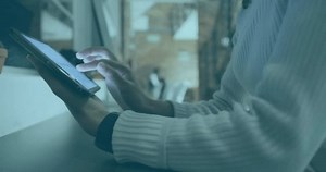 Animation of data processing and diagrams over biracial businesswoman using tablet. Global business and digital interface concept digitally generated video.
