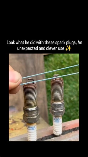 Lucky Clips on Instagram: "The video shows a simple DIY hack repurposing two used spark plugs as weighted bases for a portable mini clothesline: thread strong wire through each spark plug's center electrode terminal, stretch it taut between them, and use the line to hang small items like socks or tools for drying. Posted by @pokerface11_ on December 25, 2025, the clip exploded to 1.3 million views with 468 likes and 150 replies, predominantly from Indonesian users reacting with phrases like "jad