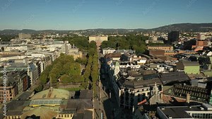 Oslo, Norway,Scandinavia. Beautiful 4K panoramic aerial video from flying drone to of the Royal Palace and Statue of King Karl Johan Oslo. In the background the castle park, the city and the mountains