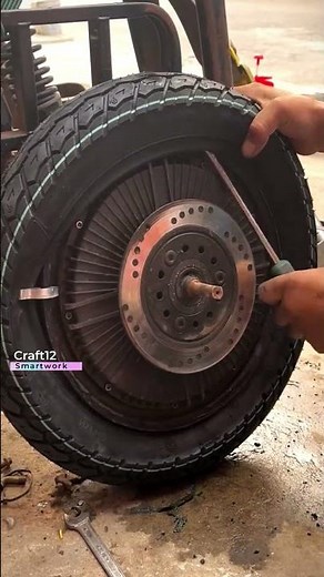 Manual Tire Mounting on Electric Vehicle Hub