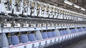 Technological process of polypropylene yarn production. The production machine lays the finished polypropylene thread on reels