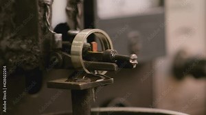 Close up shot of special machine for hallmarking jewelry , golden or silver ring . Process of probing , marking , creating precious ring . Jewellery industrial factory .