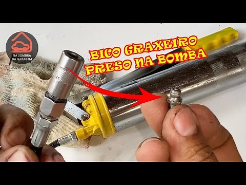HOW TO RELEASE THE GREASE PUMP HOSE FROM THE GREASE NOZZLE.