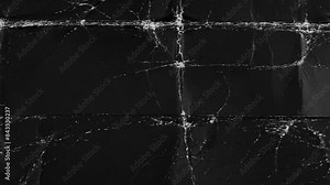 Seamless paper texture background for overlays. Looping dark grunge paper texture. Paper stop motion background. Black paper texture background. Surface Texture Background with Dark Grunge Highlights.