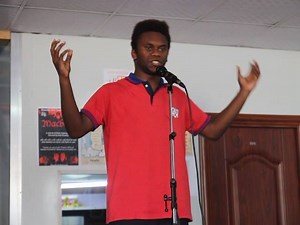 Travis from Grade 11 is performing a poem. | Paradise Academy