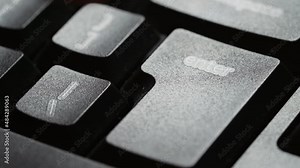 Hitting the Enter key on a desktop pc keyboard. Close up shot with finger presses a computer key. Enter key mean digital confirmation, sending message. Detail of Enter button.