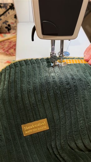 Emmaline Bags - Janelle MacKay on Instagram: "Today I was sewing some new retreat bags because we are celebrating its 10th anniversary by re-releaseing it with some additional steps to add different things like labels, zipper ends, and a two tone exterior. One of the bags I made today was made with the Wide Velvet Corduroy that we sell in the shop, and it is so cozy and soft and nice to work with, although a little messy! For this bag I used medium weight EB-fuse Interfacing on the lining, but I