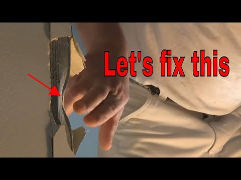 Damaged corner bead repaired with THE DRYWALL DOCTOR First Aid Kit
