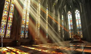 A church with stained glass windows and sunlight streaming in 4K Video