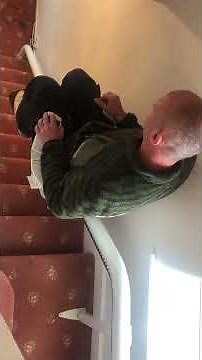 A Flow 2 Stairlift on a narrow staircase