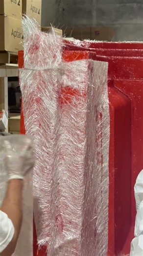 Hand-laying this layer #NuWaveComposites #FiberglassReinforcement #HandLayup #MarineManufacturing