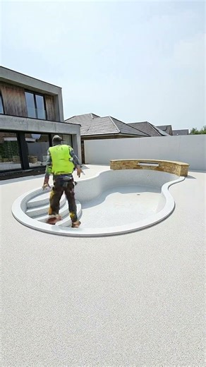 Modern Poolside Renovation Concept with Textured Epoxy Deck and Ambient Lighting