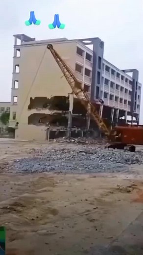 Building Demolition Process Captured on Construction Site
