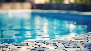 Closeup of the natural stonelike texture of designer pool tiles, replicating the beauty of a natural pool while maintaining durability and longevity.