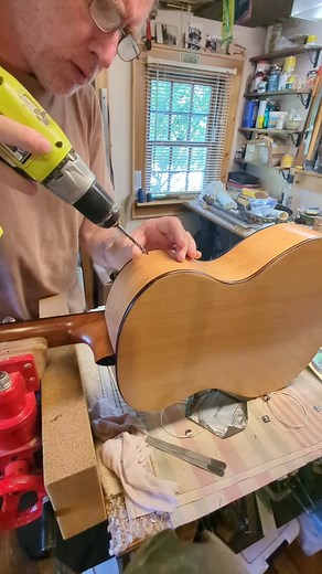 cutting a sound port, looks more scary than it is. #guitar #guitartok #acousticguitar #luthier