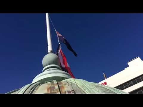 Raising the National Māori flag of New Zealand