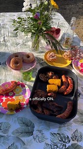 Sure sign of spring: Finns eating outdoors! 😋💚 After May Day, it’s officially picnic season in Finland. Sugar-coated doughnuts, home-made mead, delicious potato salad and sausages, sparkling drinks — what’s your favourite picnic treat? #VisitFinland #FinnDining | I wish I was in Finland