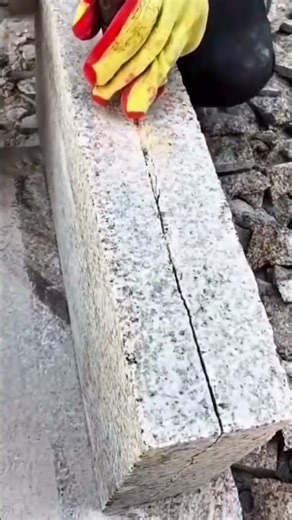 Technique for cleanly splitting a solid granite block using chisels and wedges with precision