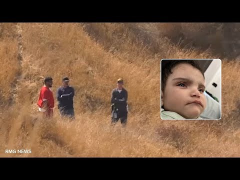 Baby Emmanuel's father seen with deputies in remote field amid search for child's body