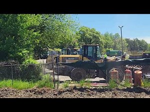 Various garbage trucks unloading at the transfer station