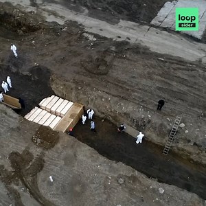 2M views · 31K shares | The bodies of COVID-19 victims are being buried in a mass graveyard in New York. | Loopsider English | Facebook