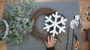 Let's make a gorgeous winter greenery grapevine with a wooden snowflake, y'all! Join Coach Mel as she brings this beauty to life! | DecoExchange