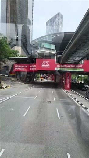 First-person view of a two-story tour bus in Kuala Lumpur