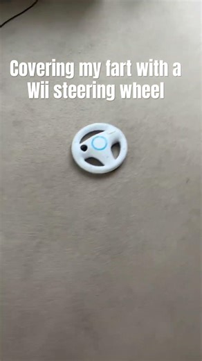 Covering my fart with a Wii steering wheel
