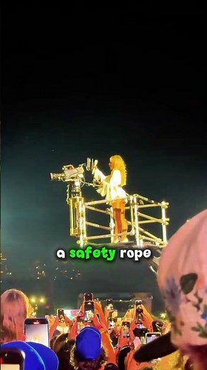 Sabrina Carpenter perfomance with a safety rope tied to her