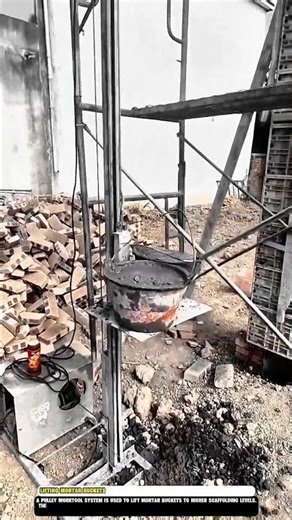 Lifting mortar buckets with pulley Worktool system on construction site