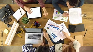 Top overhead view people group business talking on a design project plan idea. Creative modern team work meeting an at agency office. 4k indoor technology video