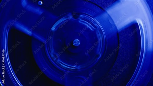 Tape audio music player, VHS studio magnetic tape, vintage retro spool reel to reel player and recorder, magnetic tape data storage close up, music studio.