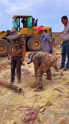 The process of rock destruction at mining or quarry sites using controlled explosions.