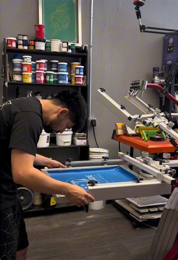 Screen set up on press. Screen printing process