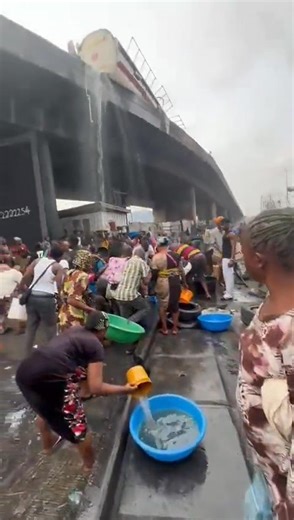 Chaos erupted at Tincan Liverpool Bridge, Apapa, as a tanker overturned on the bridge, spilling contents while residents scooped fuel beneath the bridge, raising safety fears, traffic gridlock, and urgent calls for intervention. Follow @GuardianNigeria for more updates #Apapa #TincanIsland #LagosTraffic #BreakingNews | Guardian Nigeria